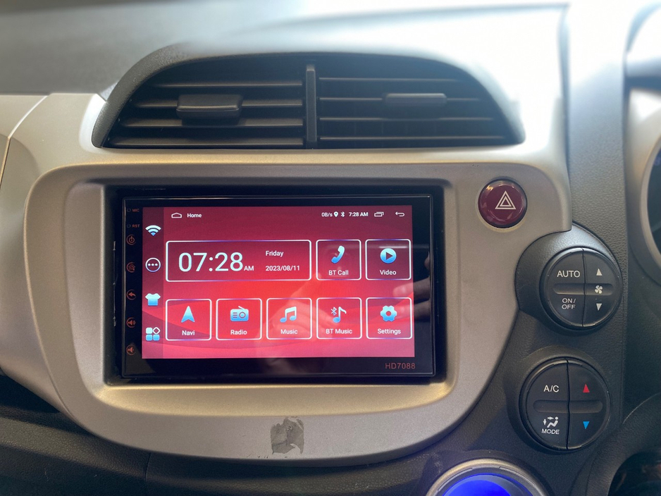 Honda Fit 1.3 HYBRID 5DR AUTO. Immaculate Car with only 108km, 2 Keys, NCT done before collection, Irish Radio with Bluetooth and Media, Climate Control, Cruise Control, Full Electrics and much more. — thumbnail 15