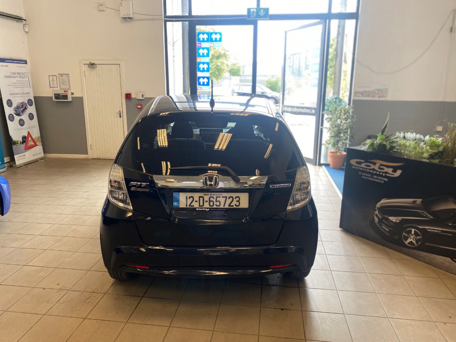 Honda Fit 1.3 HYBRID 5DR AUTO. Immaculate Car with only 108km, 2 Keys, NCT done before collection, Irish Radio with Bluetooth and Media, Climate Control, Cruise Control, Full Electrics and much more. — thumbnail 4