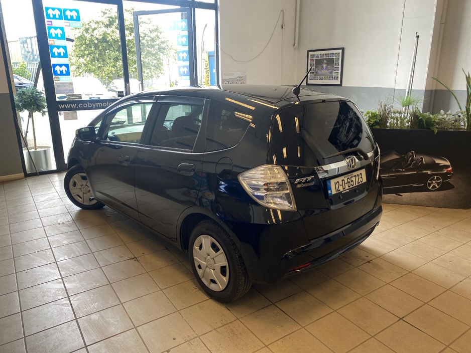 Honda Fit 1.3 HYBRID 5DR AUTO. Immaculate Car with only 108km, 2 Keys, NCT done before collection, Irish Radio with Bluetooth and Media, Climate Control, Cruise Control, Full Electrics and much more. — thumbnail 3
