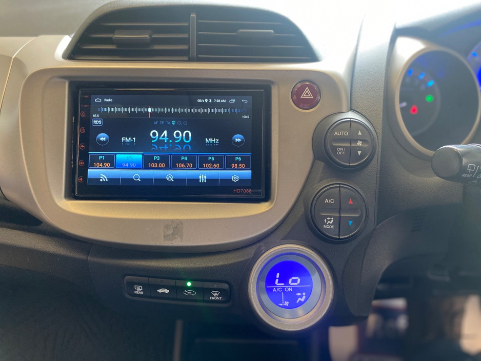 Honda Fit 1.3 HYBRID 5DR AUTO. Immaculate Car with only 108km, 2 Keys, NCT done before collection, Irish Radio with Bluetooth and Media, Climate Control, Cruise Control, Full Electrics and much more. — thumbnail 16